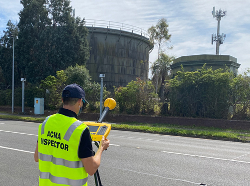 An inspector looking at EME measurements.