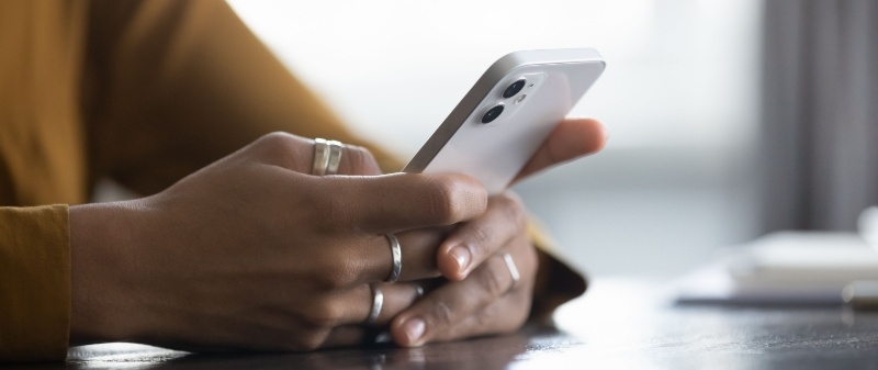 Decorative image - Person holding mobile phone