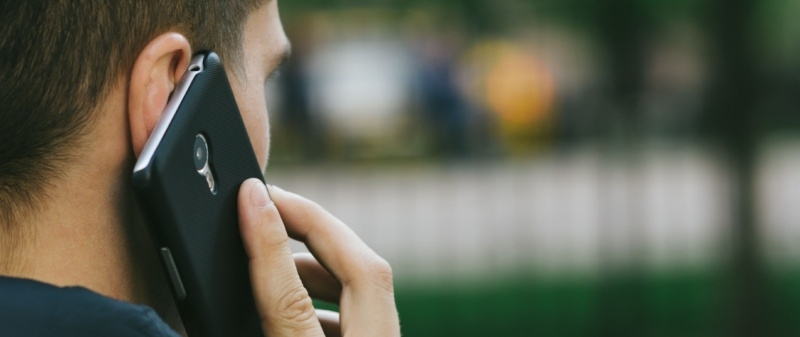 Decorative image - Man on phone outdoors