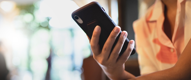 Decorative image - Woman looking at phone