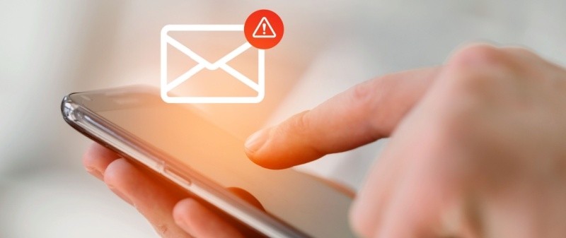 Decorative image - Person receiving text message with warning symbol