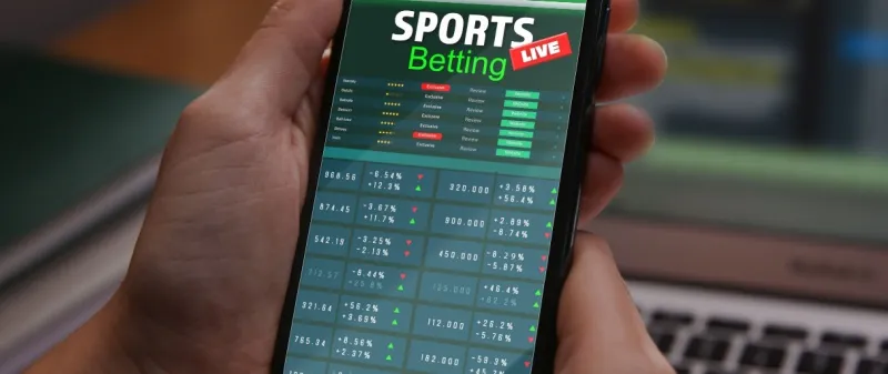 Decorative image - Person betting on phone