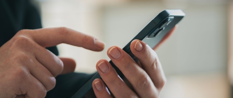 Decorative image - Person looking at content on mobile