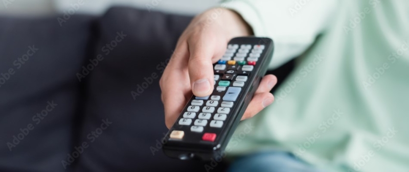Decorative image - Woman holding TV remote
