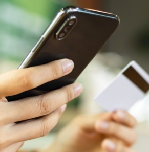 Decorative image - Woman's hands holding mobile and credit card
