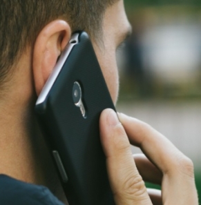 Decorative image - Man on phone outdoors