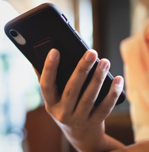 Decorative image - Woman looking at phone