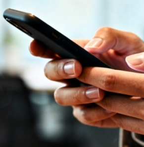 Decorative image - Woman typing on mobile phone