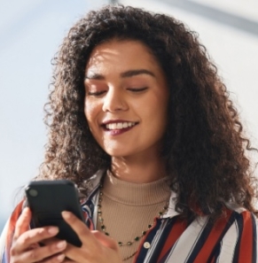 Decorative image - Happy woman looking at phone