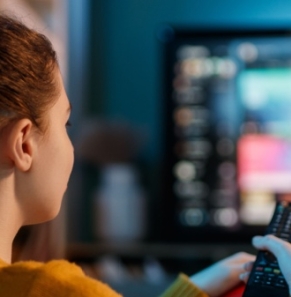 Decorative image - Woman watching TV streaming service