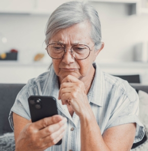 Decorative image - Woman looking at phone perplexed