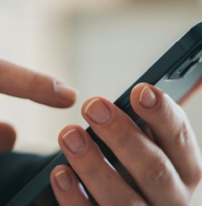 Decorative image - Person looking at content on mobile