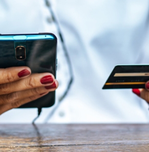 Decorative image - Woman holding mobile and credit card