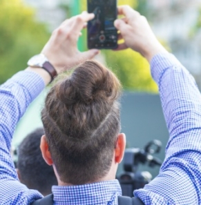 Decorative image - People filming news event