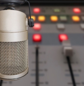Decorative image - Radio studio microphone and mixing desk