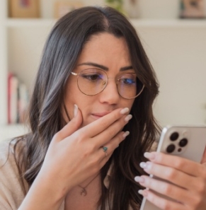 Decorative image - Woman looking at phone