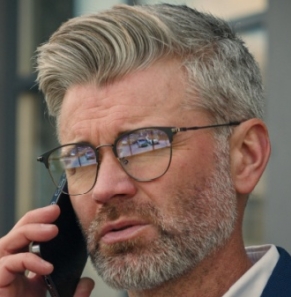 Decorative image - Man on phone outside building