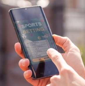 Decorative image - Man sports betting on mobile phone