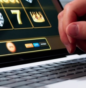 Decorative image - Person playing online poker on laptop