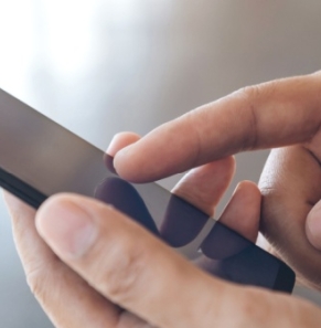 Decorative image - Person scrolling on mobile phone