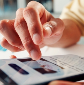 Decorative image - Person scrolling news article on phone