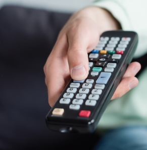 Decorative image - Woman holding TV remote
