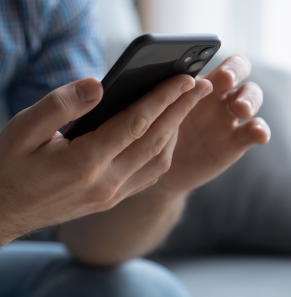 Decorative image - Man scrolling on mobile phone