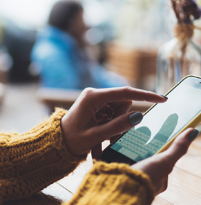 Person typing on mobile device