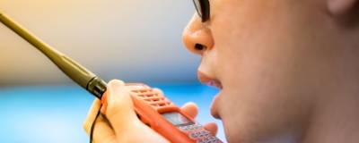 Decorative image - Man talking on walkie talkie