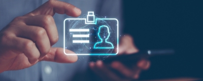 Decorative image - Person verifying digital ID on mobile phone