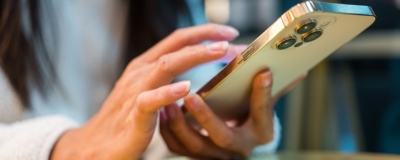 Decorative image - Person scrolling on mobile phone