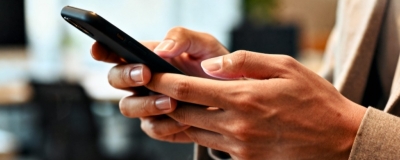 Decorative image - Woman typing on mobile phone