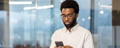 Decorative image - Person reading content on phone