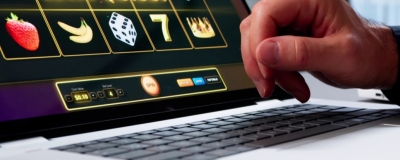 Decorative image - Person playing online poker on laptop