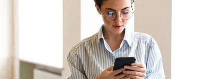 Decorative image: Person using a mobile phone