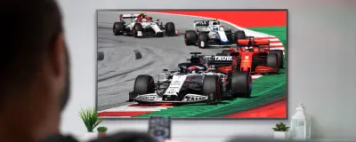 Decorative image - Man watching formula one racing on TV