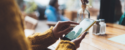 Person typing on mobile device
