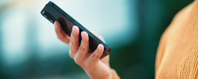 Decorative image: Person using a mobile phone